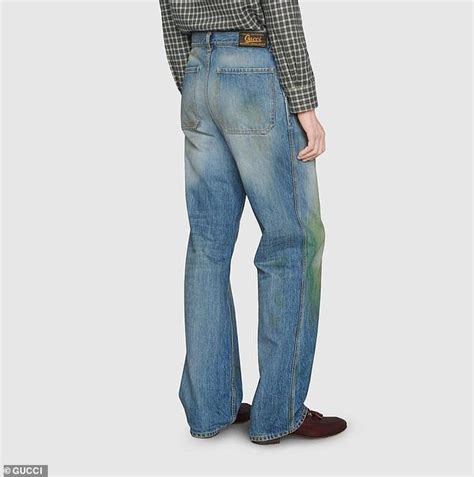 Gucci unveil distressed jeans that have the illusion of grass stains